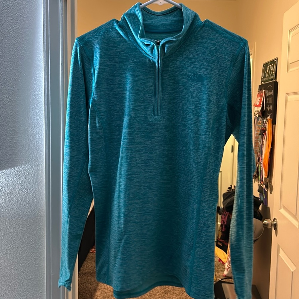The North Face quarter zip runners top. Teal color. Women’s size medium.